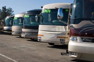 group of RVs lined up for sale at RV dealership RV show