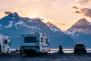 four winds RV at campsite with mountains renting an RV from RVnGO