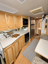 Brightened RV kitchen and dinette interior.png thumbnail 5